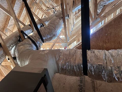 Insulated flex duct runs in an attic