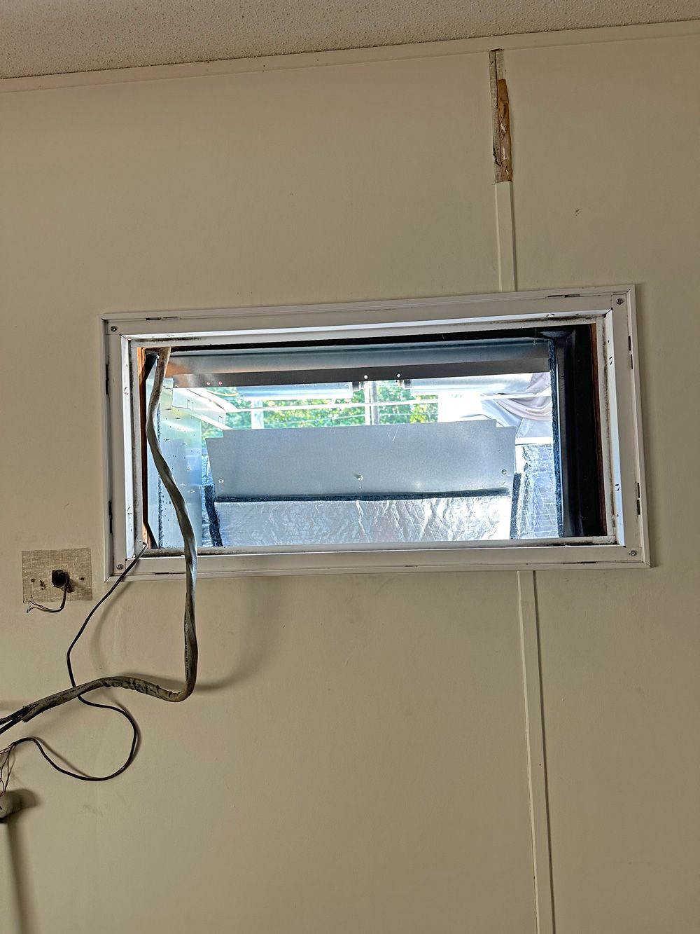 Wall opening prepared for ductless unit installation by Arctic Air Conditioning